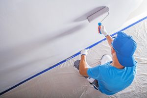 Residential Painter Paiting Wall with Paint Roller